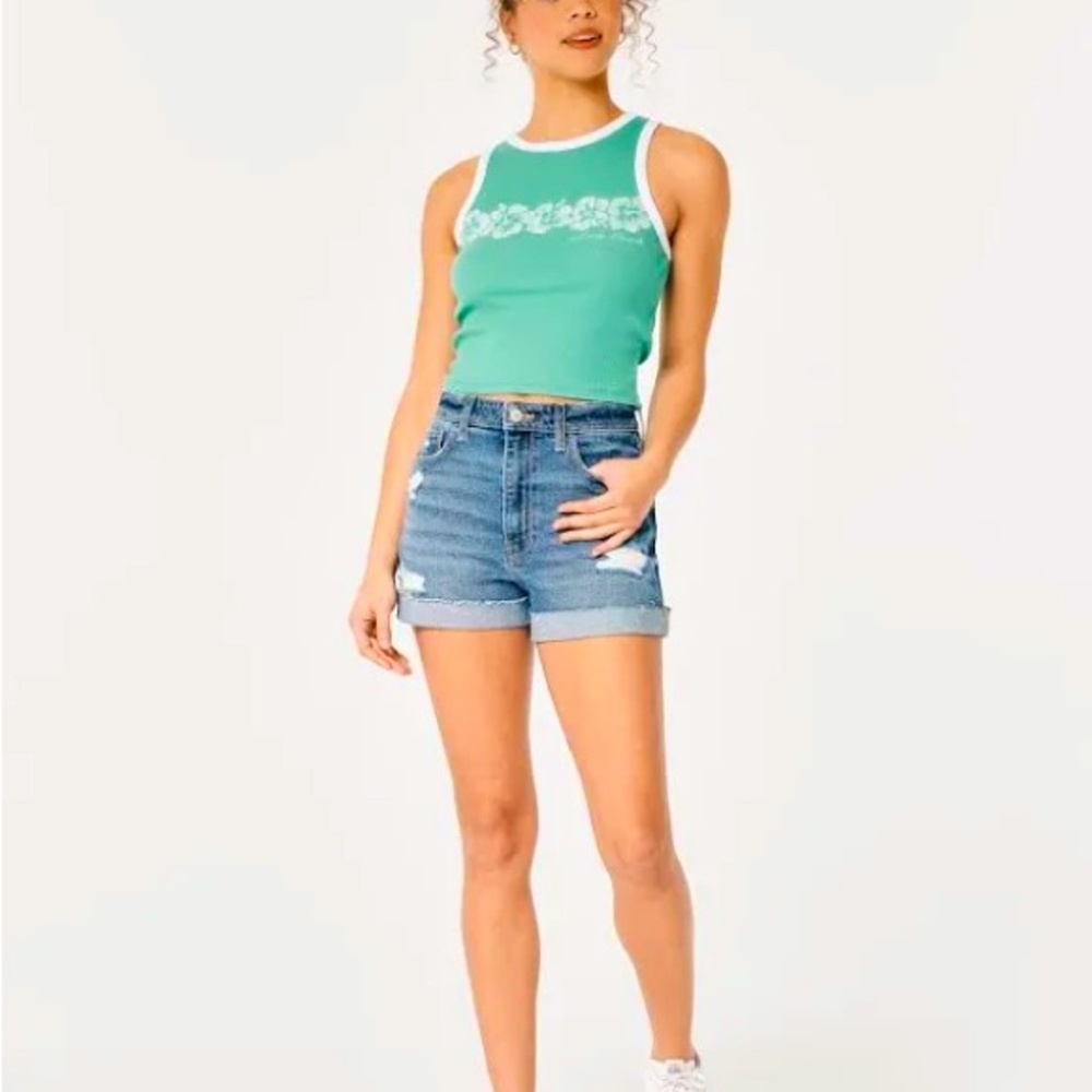 Cute green summer tank by Hollister with flower graphics on the chest